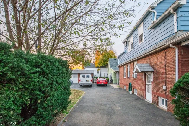 a kitchen with a table chairs and a refrigerator