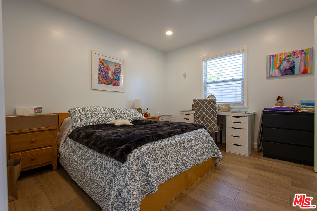 5123 Noble Avenue Sherman Oaks, CA 91403 - Photo 13 of 22 a bedroom with a bed and a closet