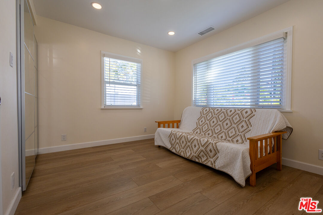 5123 Noble Avenue Sherman Oaks, CA 91403 - Photo 15 of 22 a bed room with a bed and a couch
