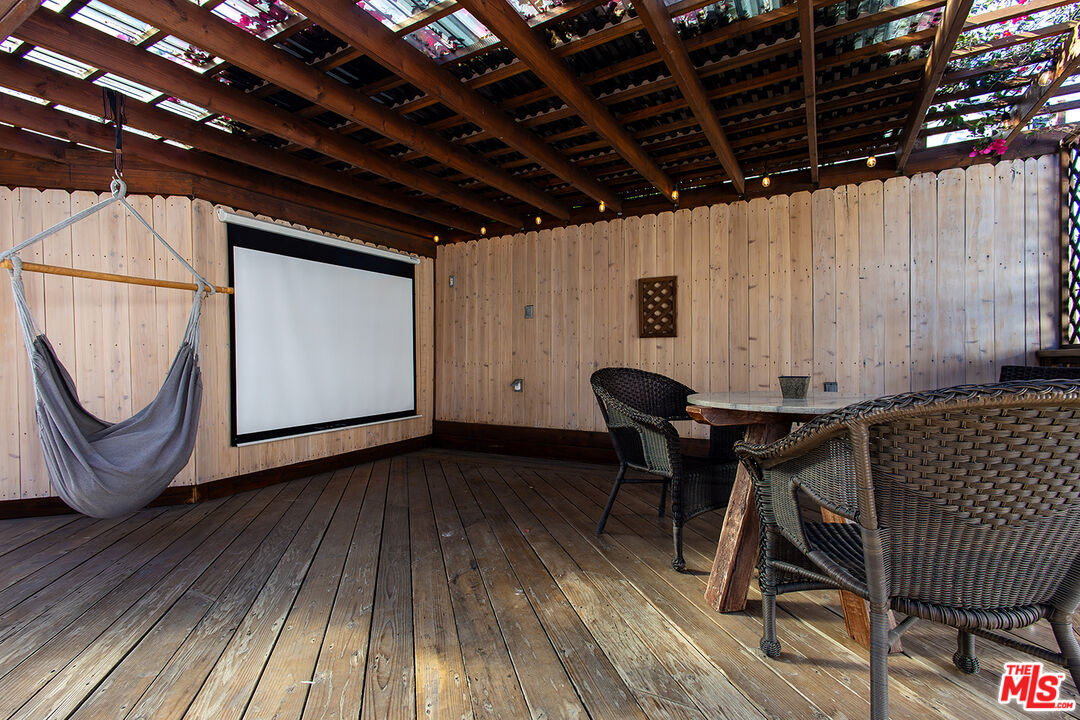 5123 Noble Avenue Sherman Oaks, CA 91403 - Photo 19 of 22 a view of a roof deck with wooden floor and fence