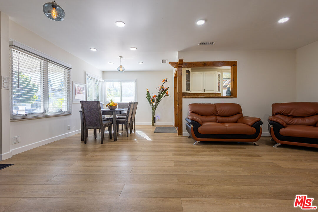 5123 Noble Avenue Sherman Oaks, CA 91403 - Photo 3 of 22 a living room with furniture and a wooden floor