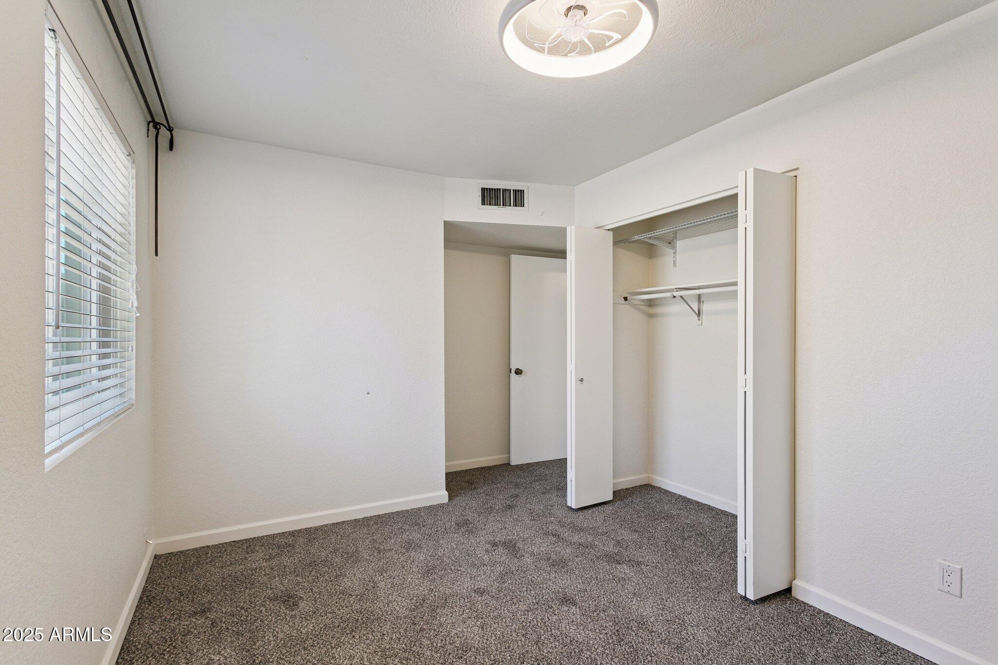 4915 East Everett Drive Scottsdale, AZ 85254 - Photo 24 of 39 a view of an empty room with a window