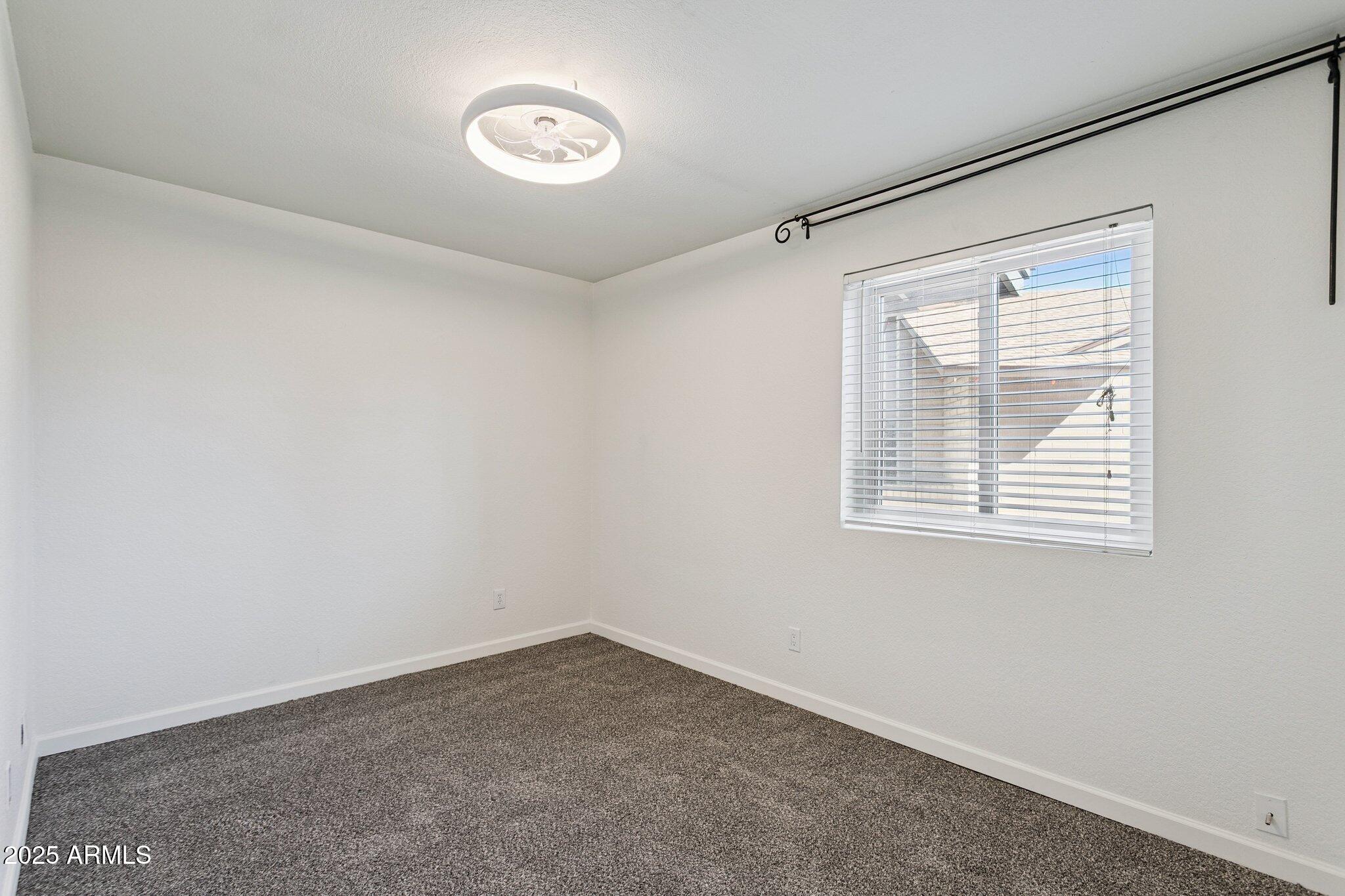 4915 East Everett Drive Scottsdale, AZ 85254 - Photo 26 of 39 an empty room with a window
