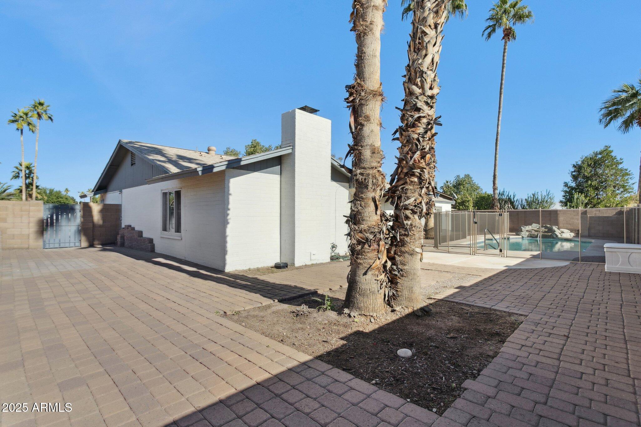 4915 East Everett Drive Scottsdale, AZ 85254 - Photo 36 of 39 a view of a house with backyard and trees