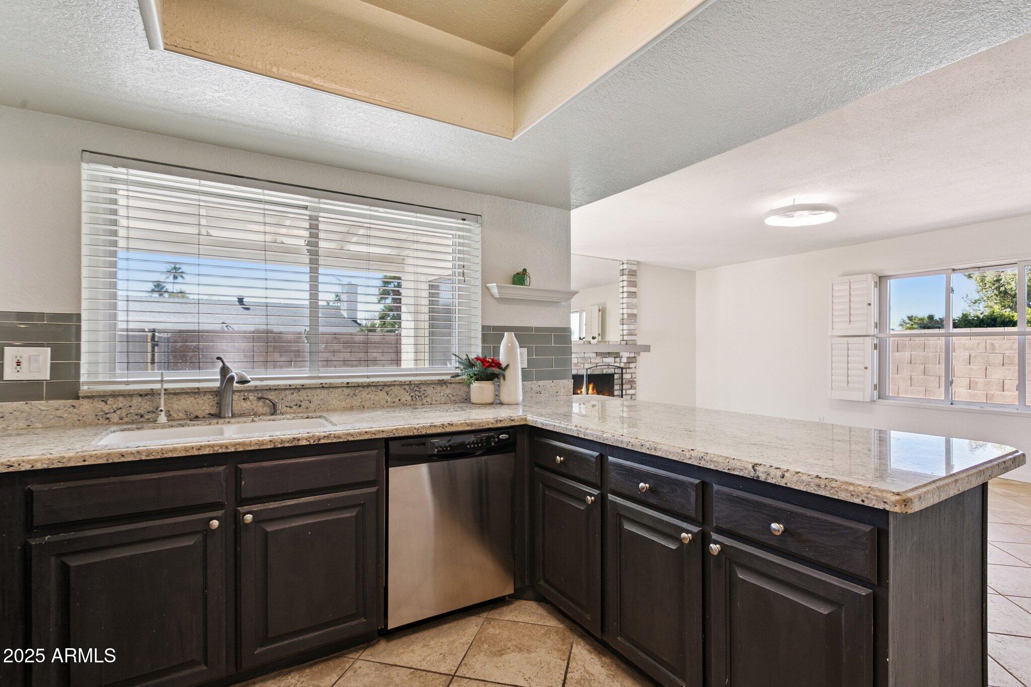 4915 East Everett Drive Scottsdale, AZ 85254 - Photo 6 of 39 a kitchen with a sink and cabinets