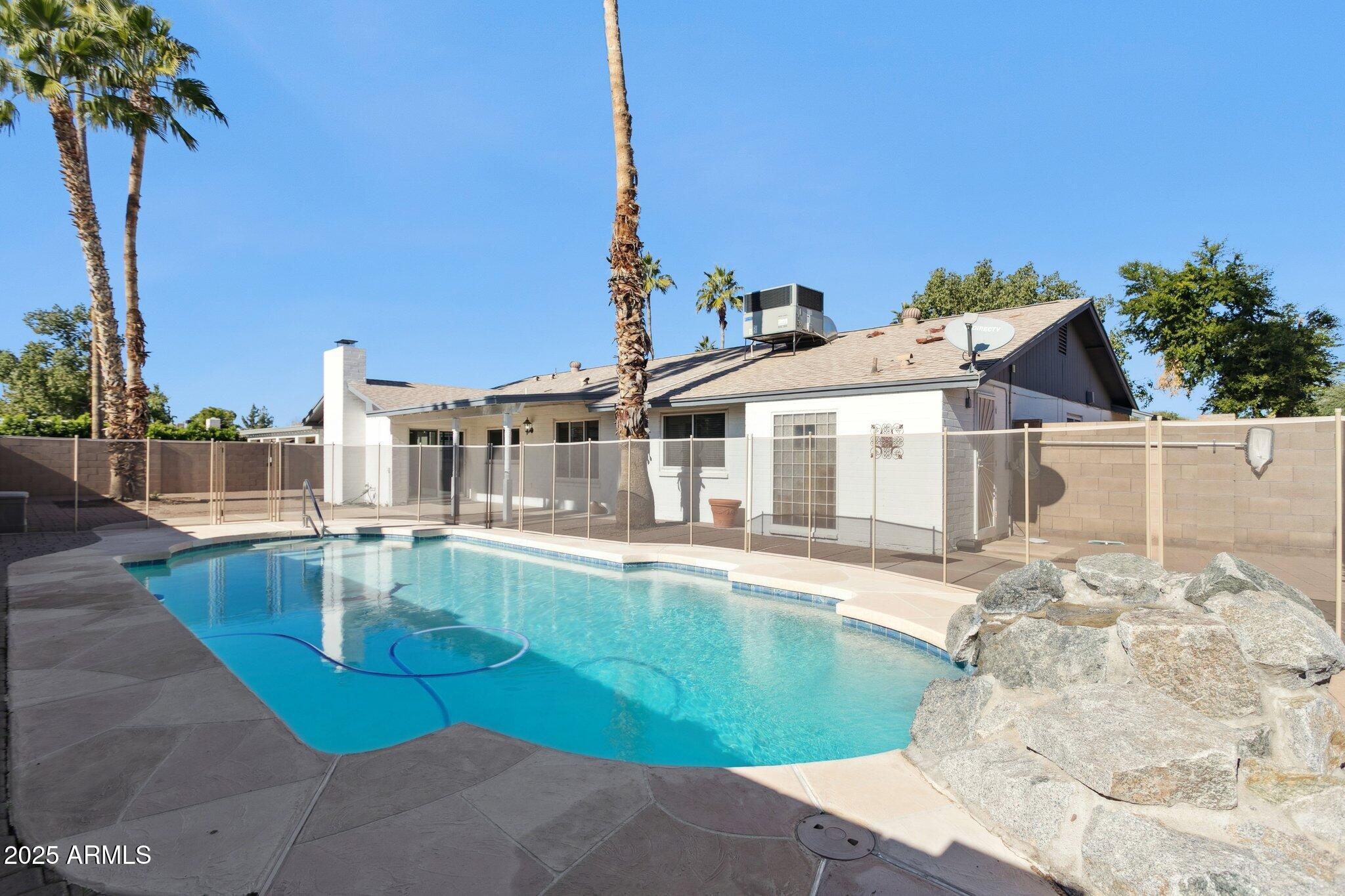 4915 East Everett Drive Scottsdale, AZ 85254 - Photo 8 of 39 a view of a house with pool and sitting area
