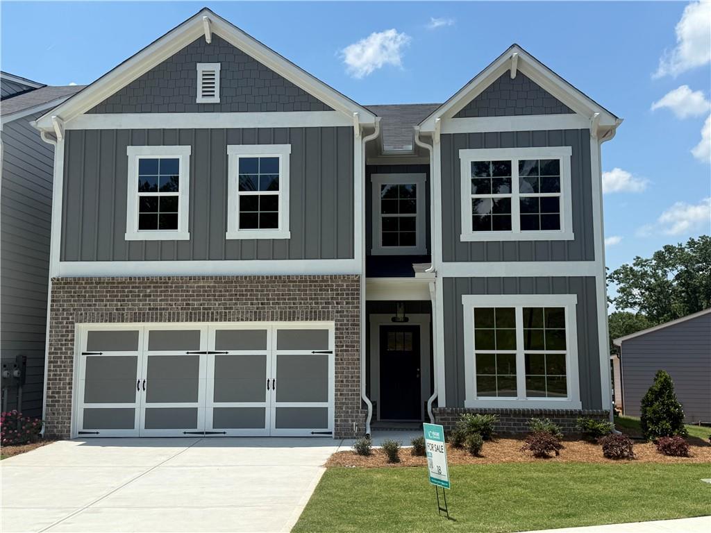 front view of a house with a yard