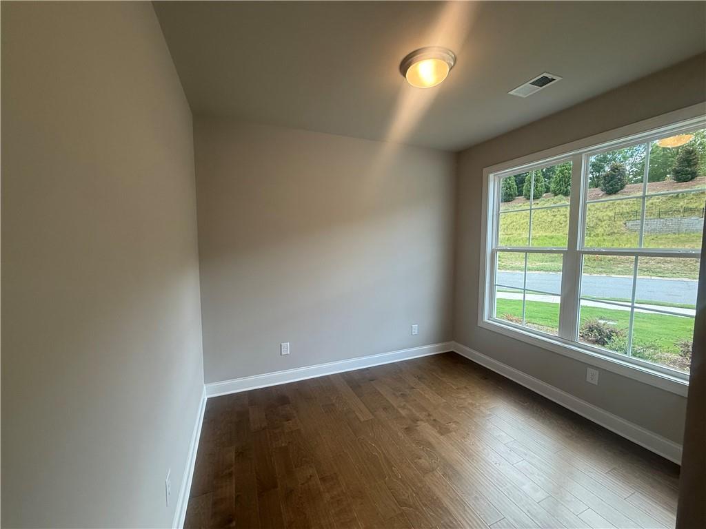 329 Lakeside Drive Canton, GA 30114 - Photo 2 of 34 an empty room with wooden floor and windows