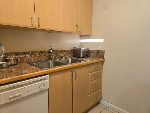 a kitchen with appliances cabinets and a counter top