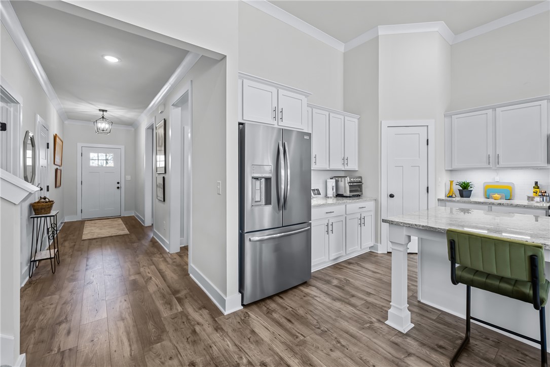 135 Bowers Estates Road Hartwell, GA 30643 - Photo 4 of 35 This kitchen and entry blend functionality with elegant design for daily living.