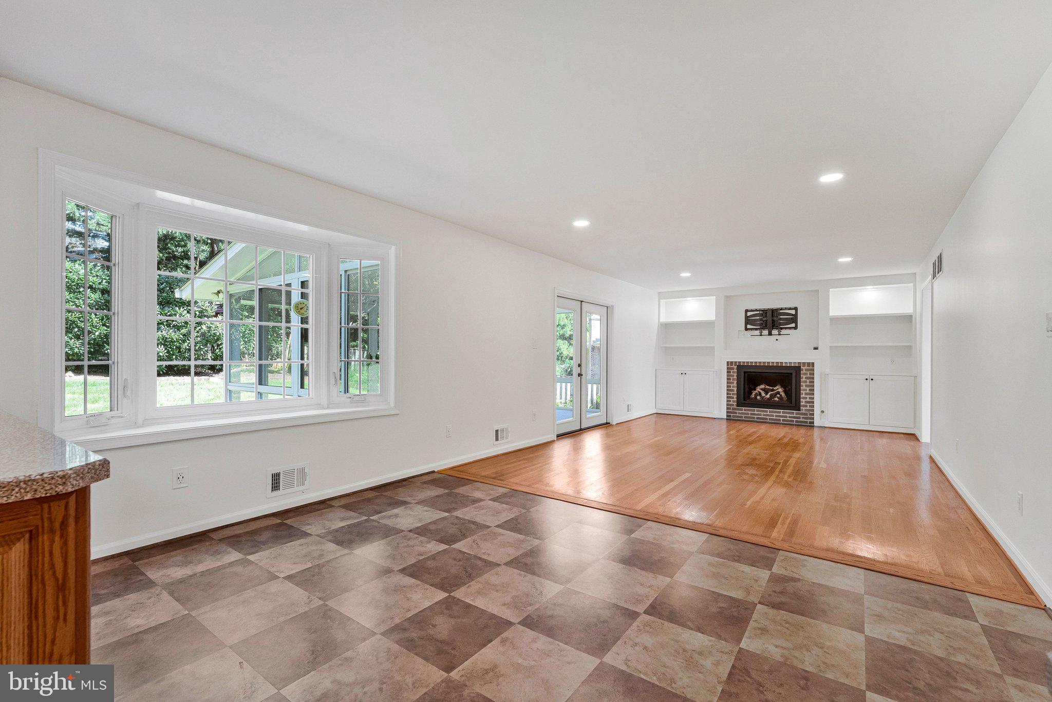 7730 Falstaff Road McLean, VA 22102 - Photo 28 of 83 Family room with gas fireplace and tv mount
