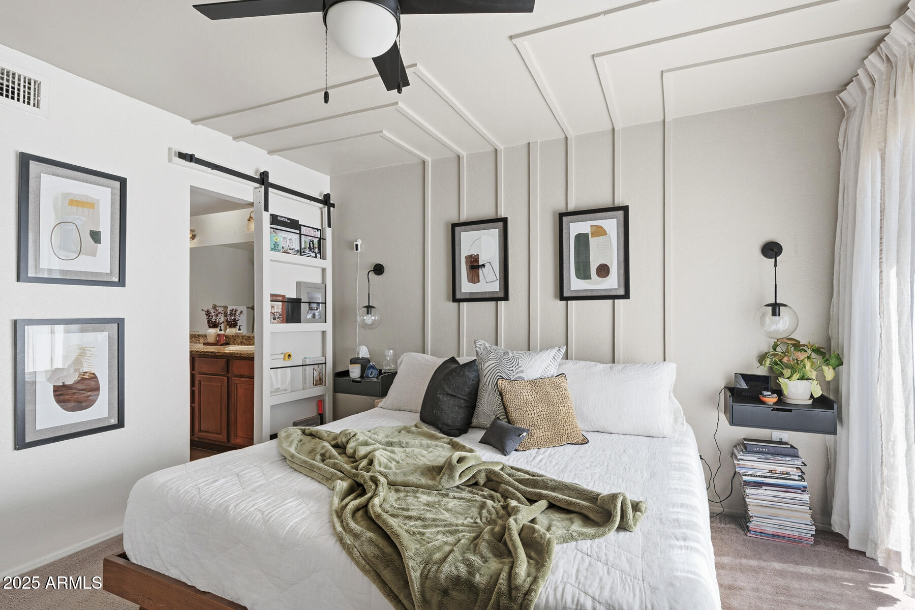 835 North Granite Reef Road, Unit 12 Scottsdale, AZ 85257 - Photo 13 of 23 a bedroom with a bed and ceiling fan