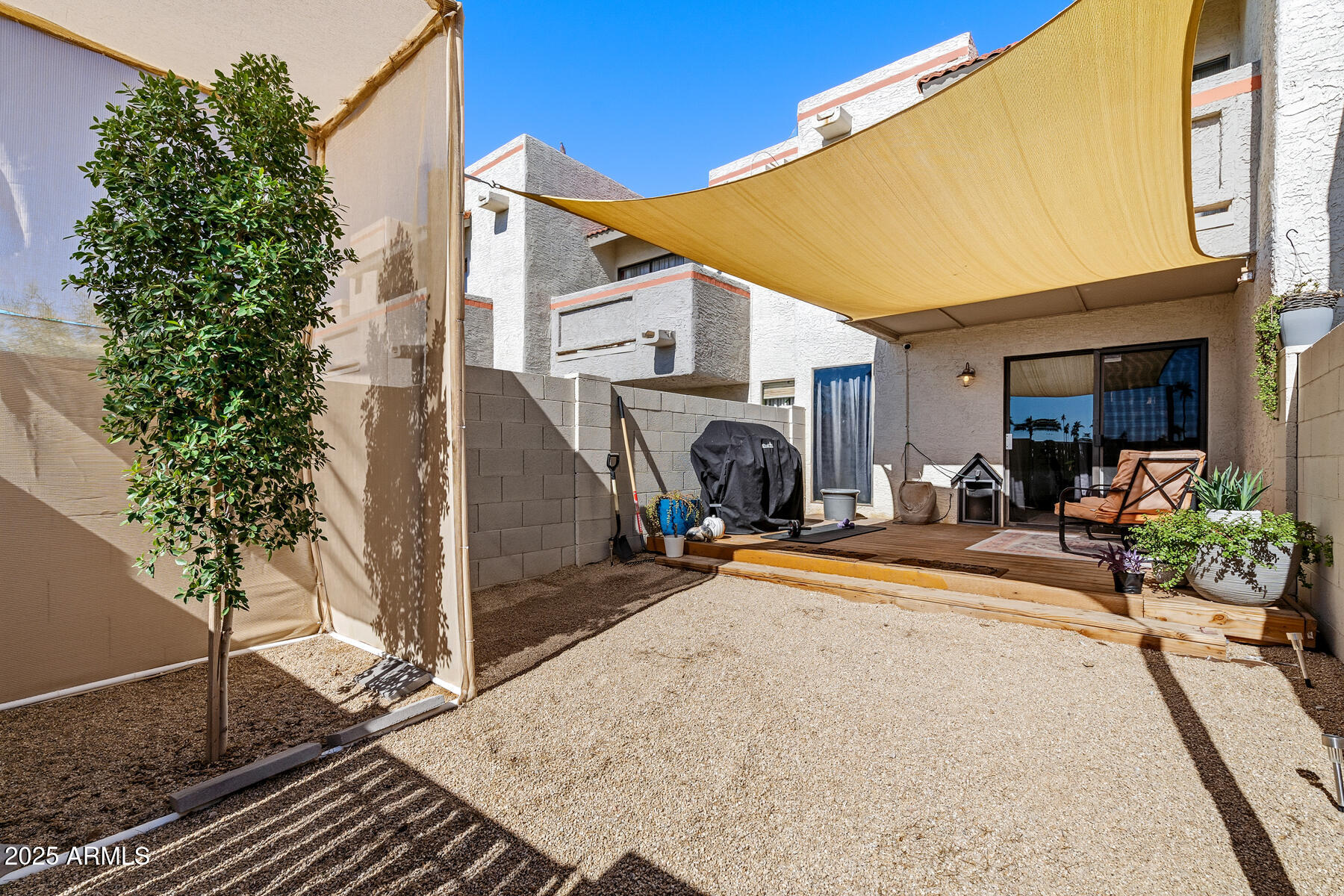 835 North Granite Reef Road, Unit 12 Scottsdale, AZ 85257 - Photo 2 of 23 a view of a backyard with furniture and a patio