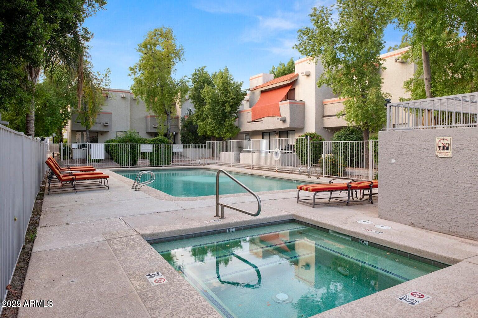 835 North Granite Reef Road, Unit 12 Scottsdale, AZ 85257 - Photo 22 of 23 swimming pool view with a seating space and a garden