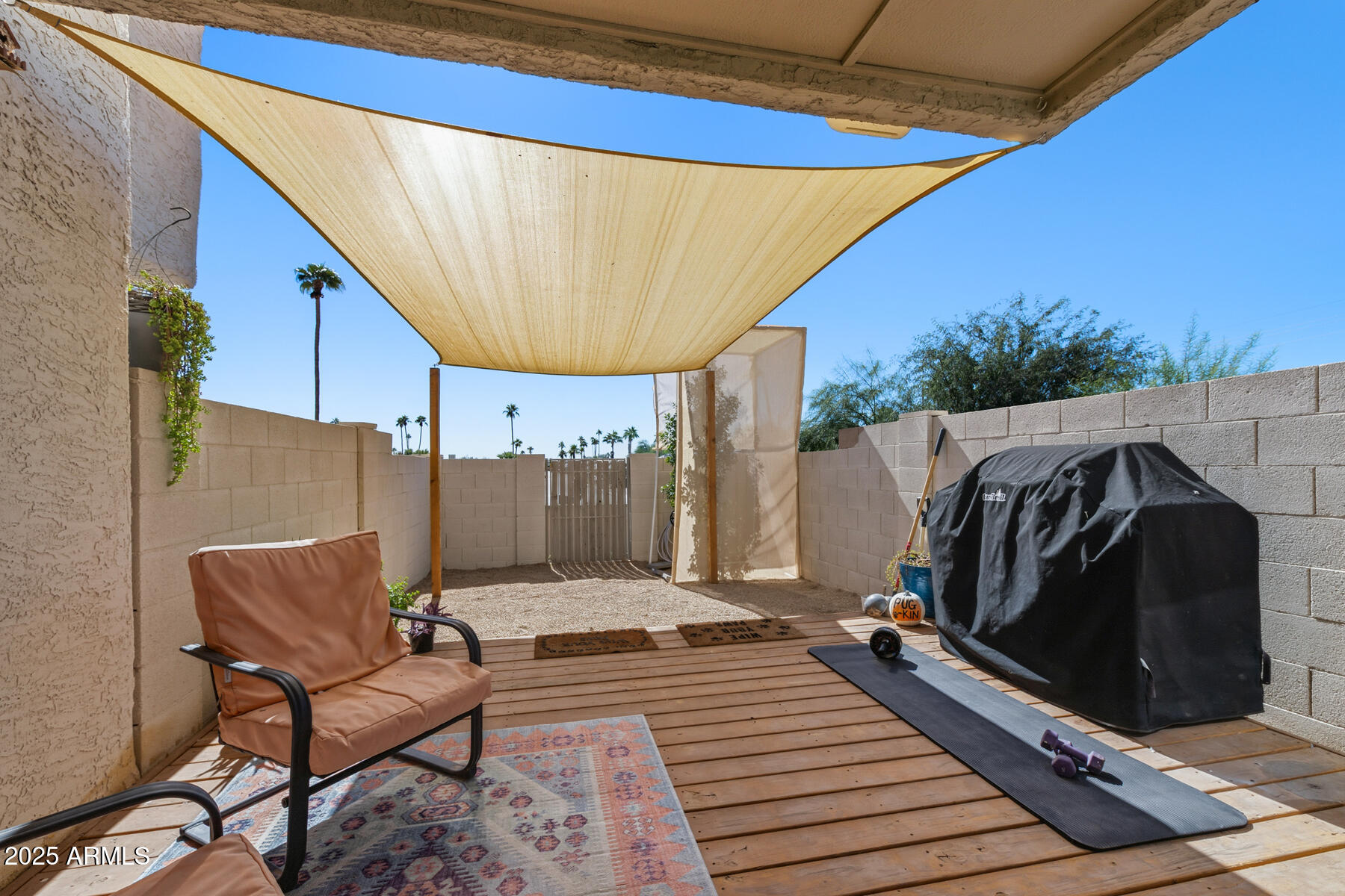 835 North Granite Reef Road, Unit 12 Scottsdale, AZ 85257 - Photo 3 of 23 a view of a balcony with furniture and a potted plant