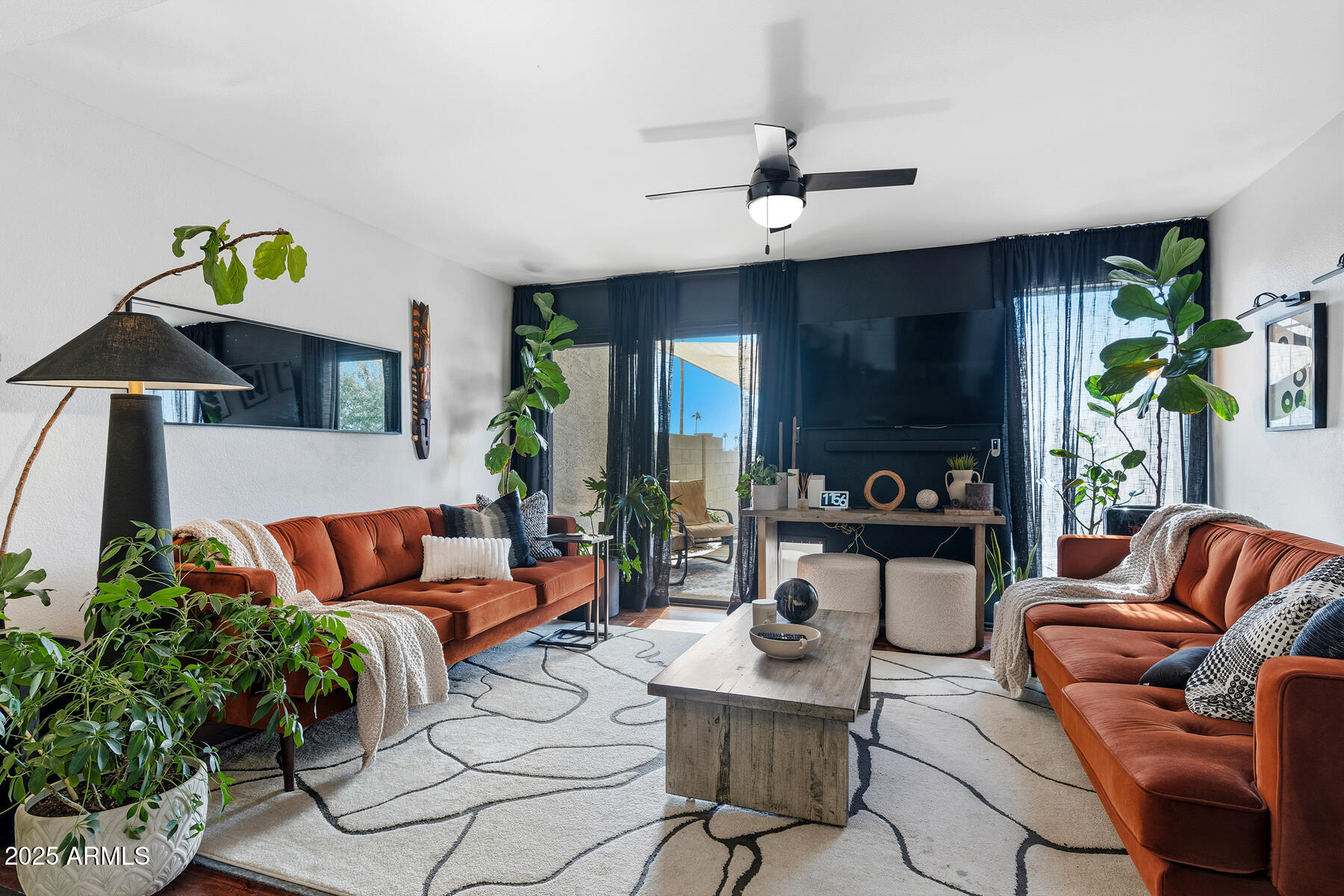 835 North Granite Reef Road, Unit 12 Scottsdale, AZ 85257 - Photo 5 of 23 a living room with furniture and wooden floor