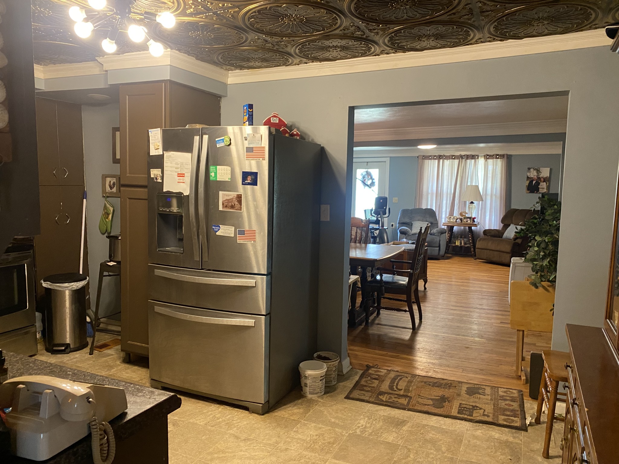 691 Hodges Bridge Road Doyle, TN 38559 - Photo 16 of 42 a kitchen with a refrigerator and table chairs