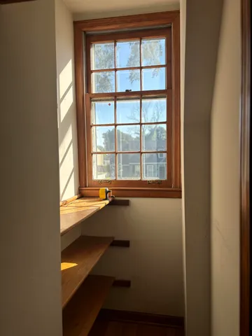 a view of an empty room with a window