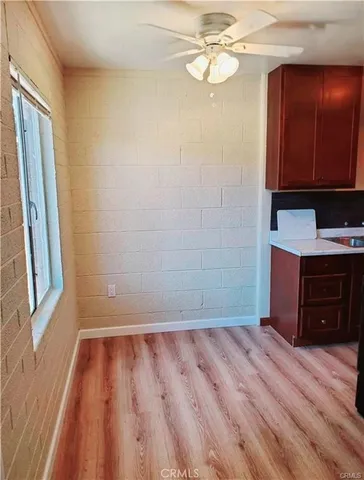 a view of a room with wooden floor and staircase