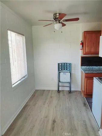 a view of room with window and ceiling fan