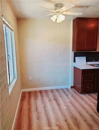 a view of a room with wooden floor and staircase