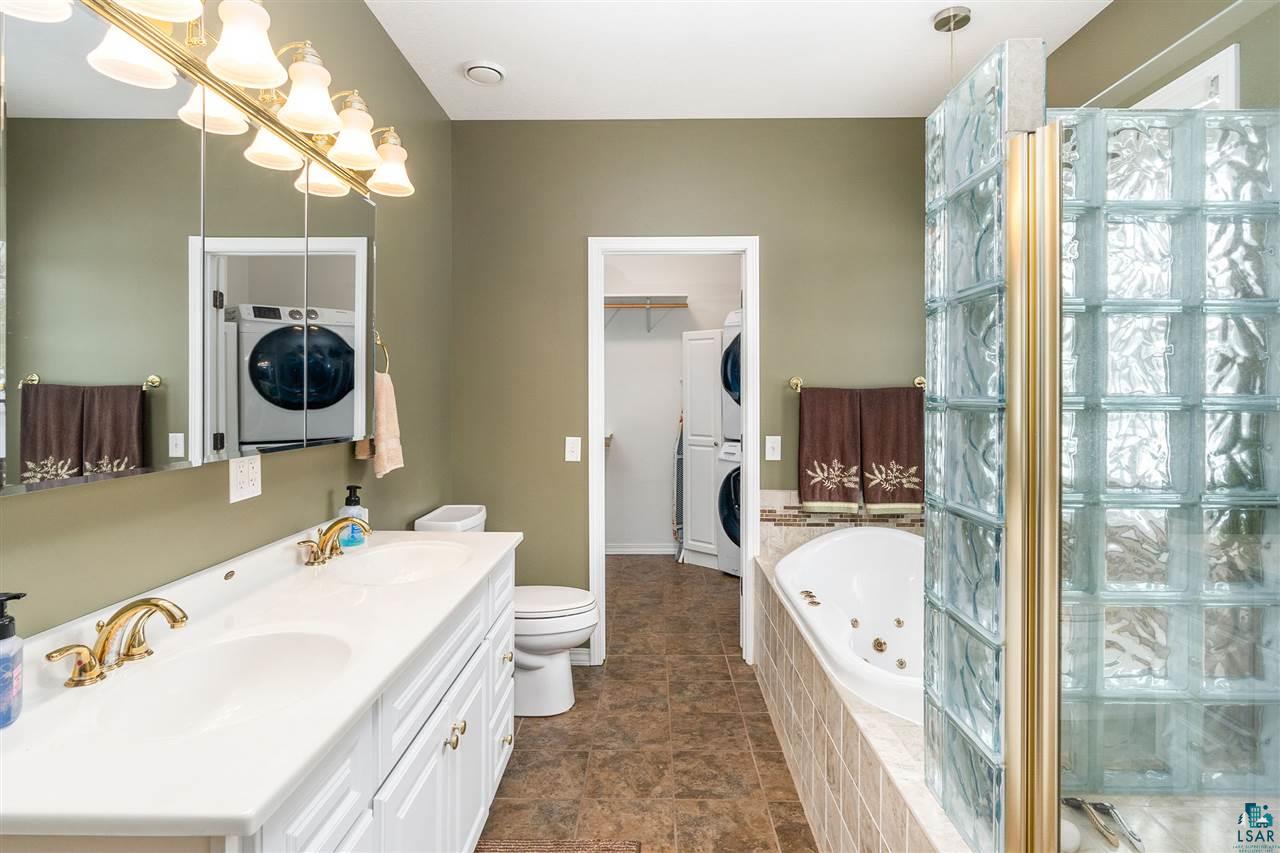 134 West Harney Road Esko, MN 55733 - Photo 28 of 50 The master bath connects to the laundry room as well.