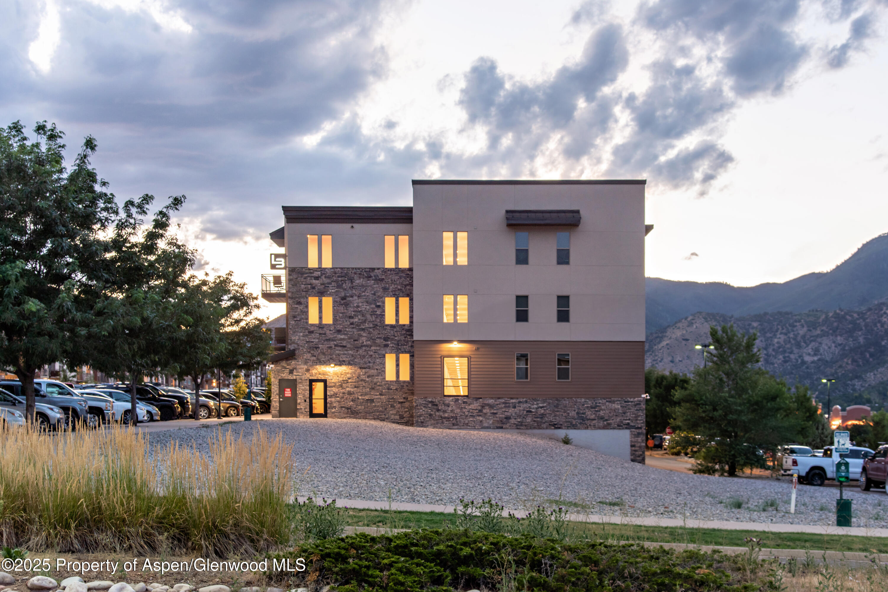 253 Wulfsohn Road, Unit 301 Glenwood Springs, CO 81601 - Photo 44 of 45 a front view of a house with a yard