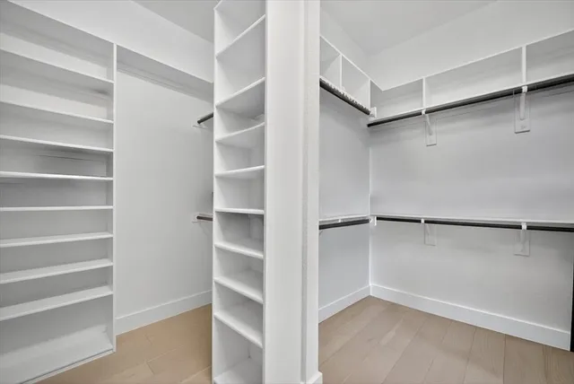 a view of an empty walk in closet