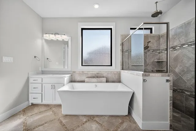 a bathroom with a sink and mirror