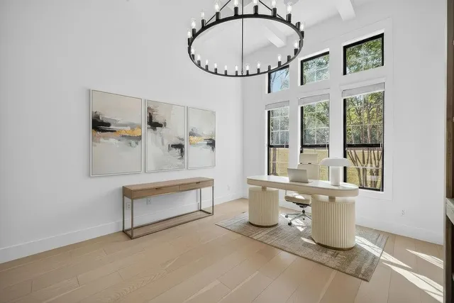 a view of a living room and chandelier