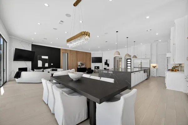 a large kitchen with a large counter top appliances and cabinets