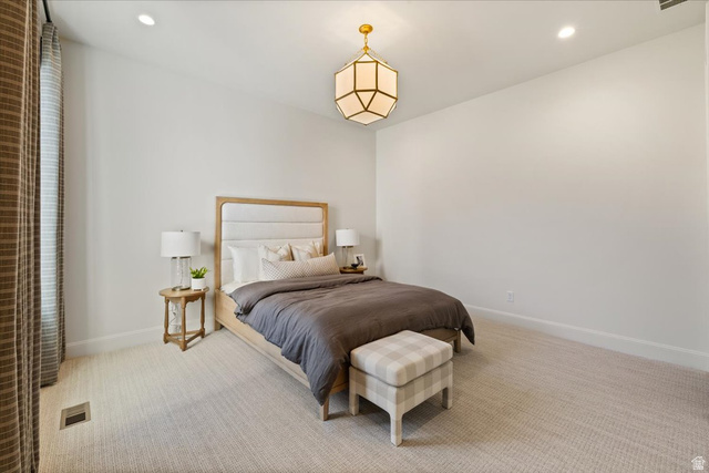 478 South Maple Lakes Drive Mapleton, UT 84664 - Photo 27 of 51 Spacious room featuring light-colored carpeting, recessed lighting, and a prominent geometric brass chandelier