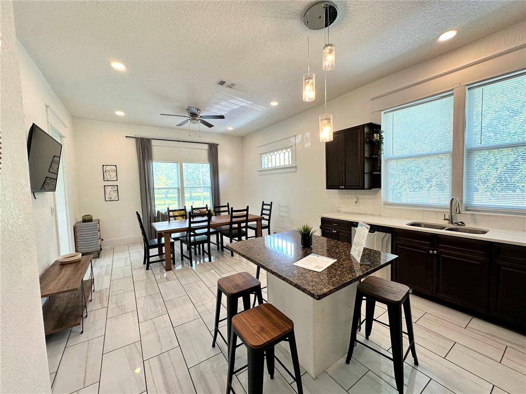 3105 West Spruce Street Tampa, FL 33607 - Photo 17 of 53 a view of a dining room with furniture window and outside view