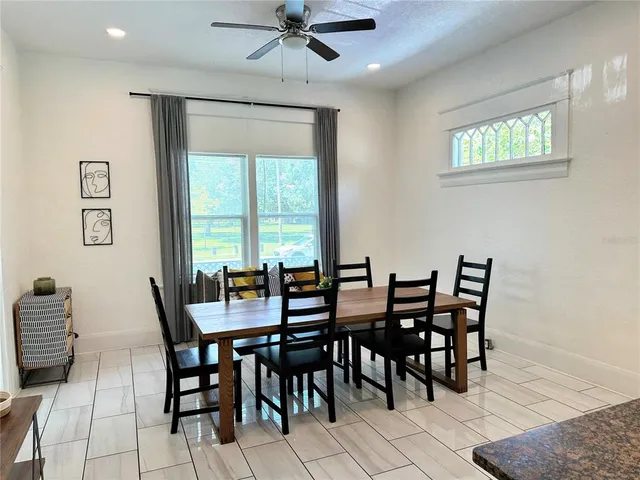 a view of a dining room with furniture