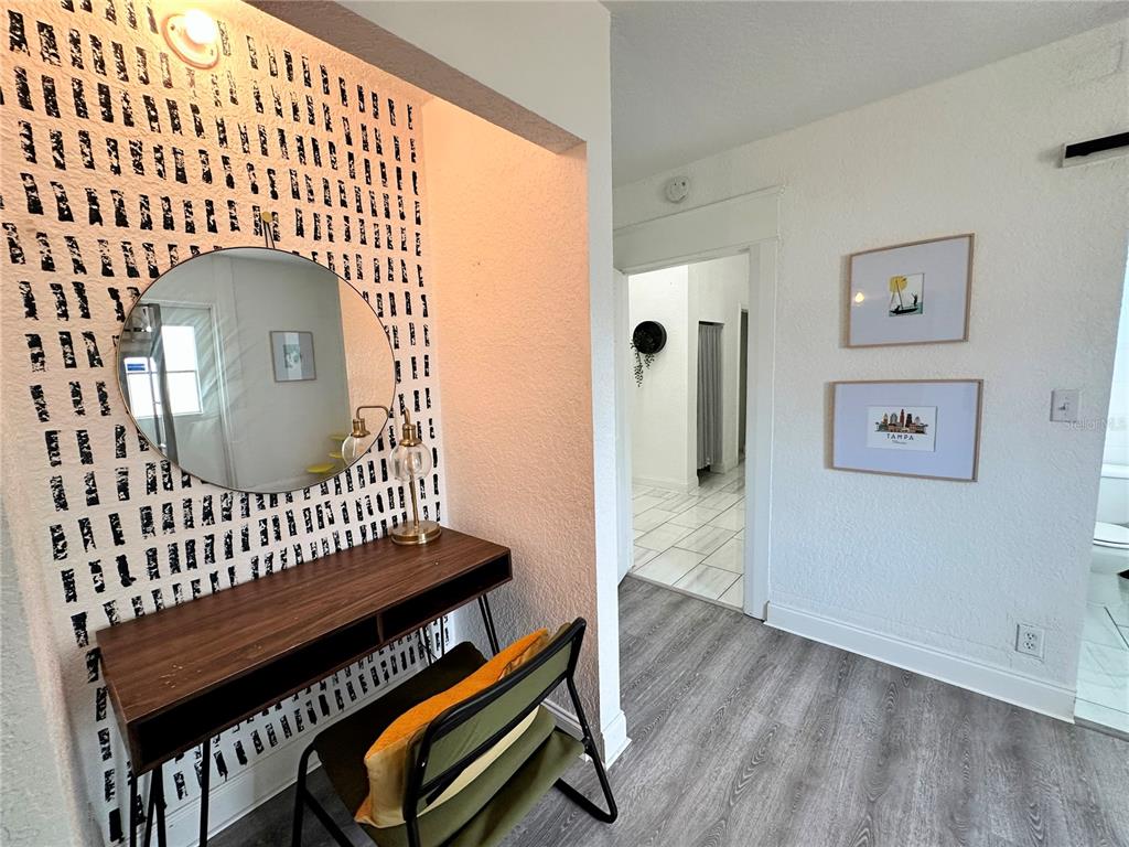3105 West Spruce Street Tampa, FL 33607 - Photo 39 of 53 a view of a hallway with wooden floor and a bathroom