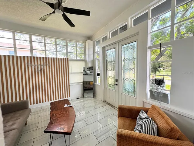 a living room with furniture and a window