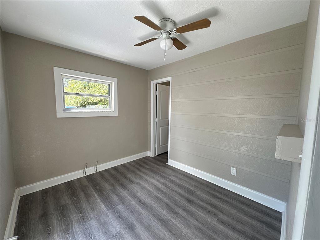 3105 West Spruce Street Tampa, FL 33607 - Photo 51 of 53 wooden floor in an empty room with a window