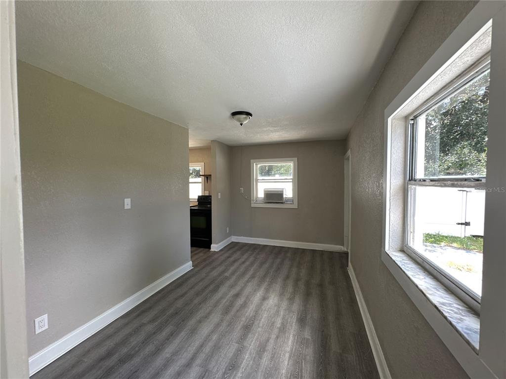 3105 West Spruce Street Tampa, FL 33607 - Photo 53 of 53 a view of empty room with wooden floor and fan