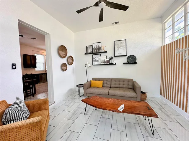 a living room with furniture and a rug