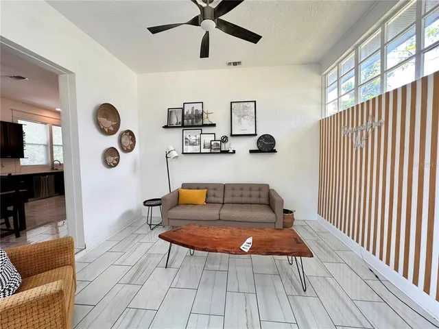 a living room with furniture and a rug
