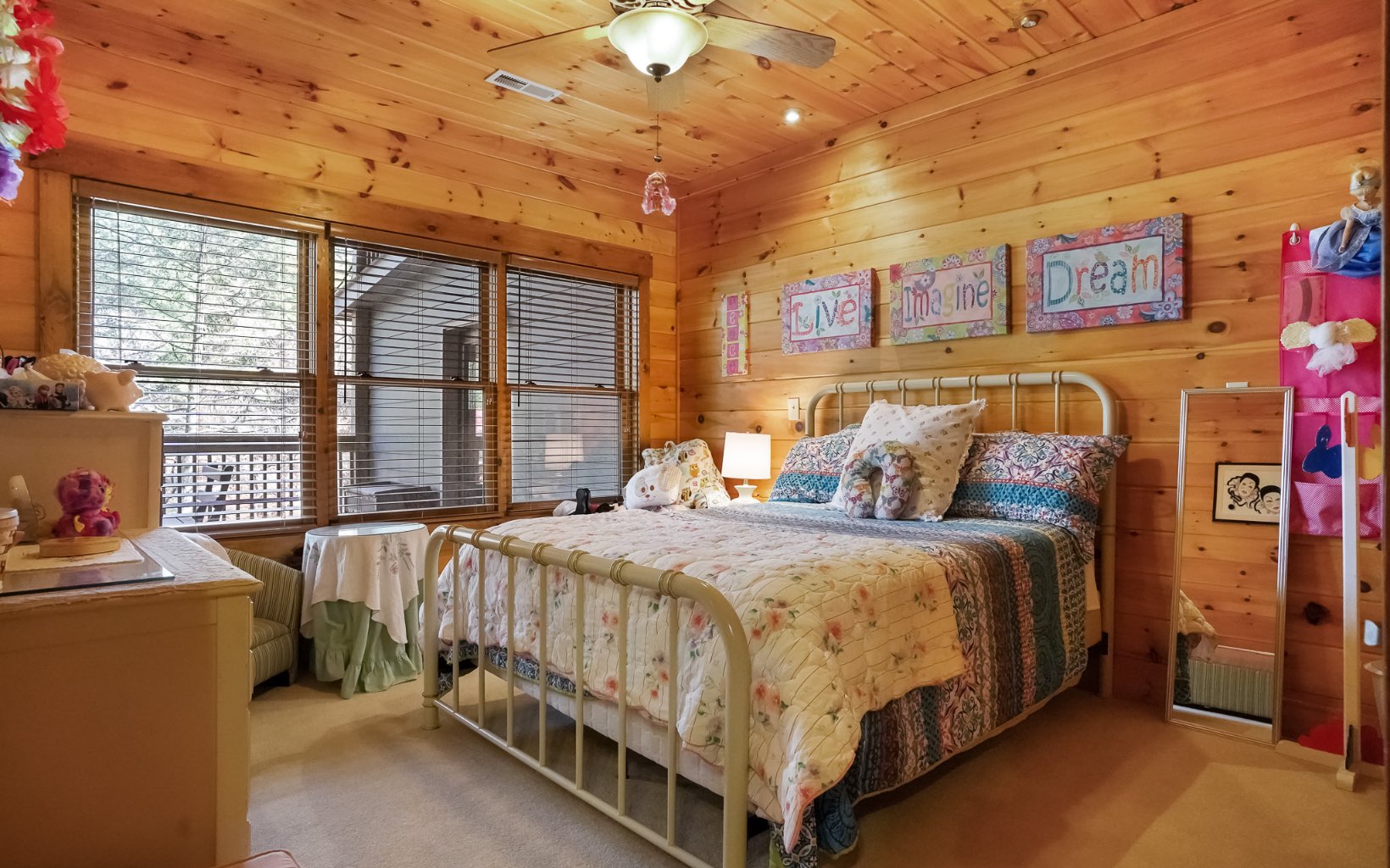 986 Shady Falls Road Blue Ridge, GA 30513 - Photo 28 of 68 a bed sitting in a bedroom next to a window