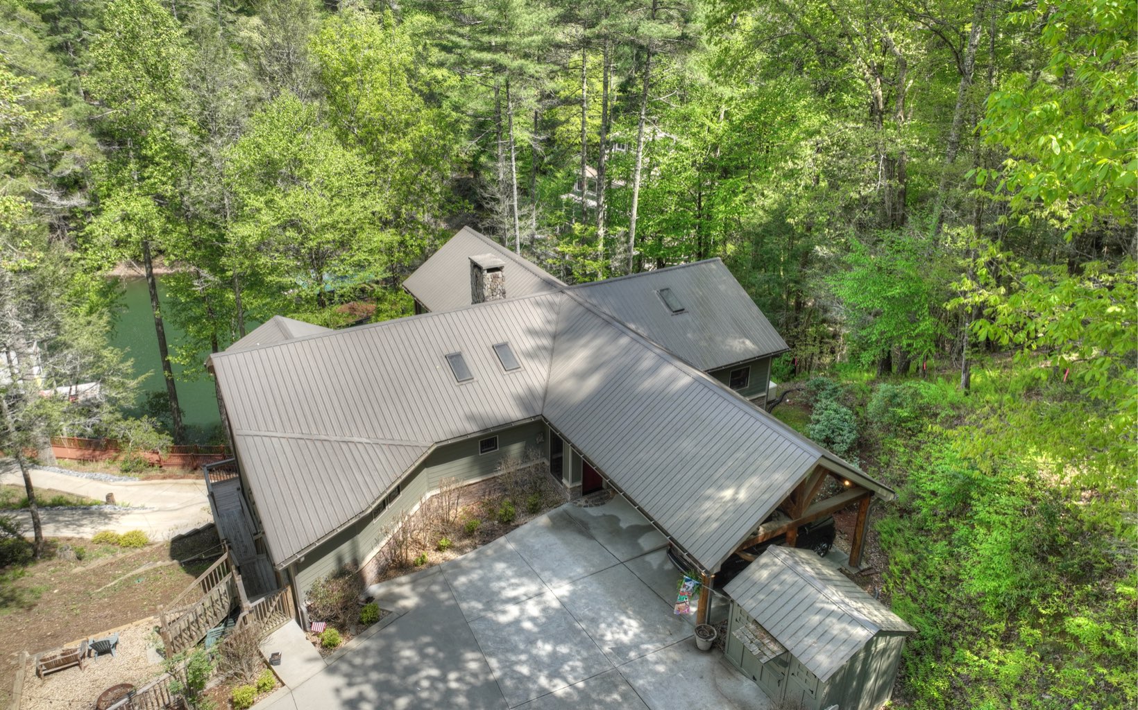 986 Shady Falls Road Blue Ridge, GA 30513 - Photo 65 of 68 an aerial view of a house with backyard