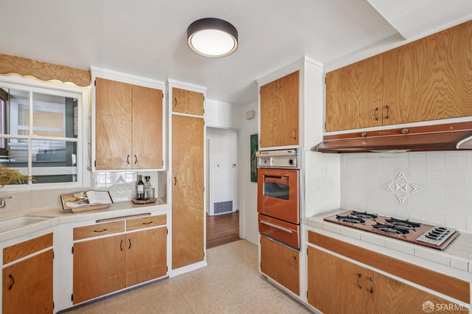 2015-2017 Judah Street San Francisco, CA 94122 - Photo 14 of 58 a kitchen with stainless steel appliances a stove a sink and a refrigerator