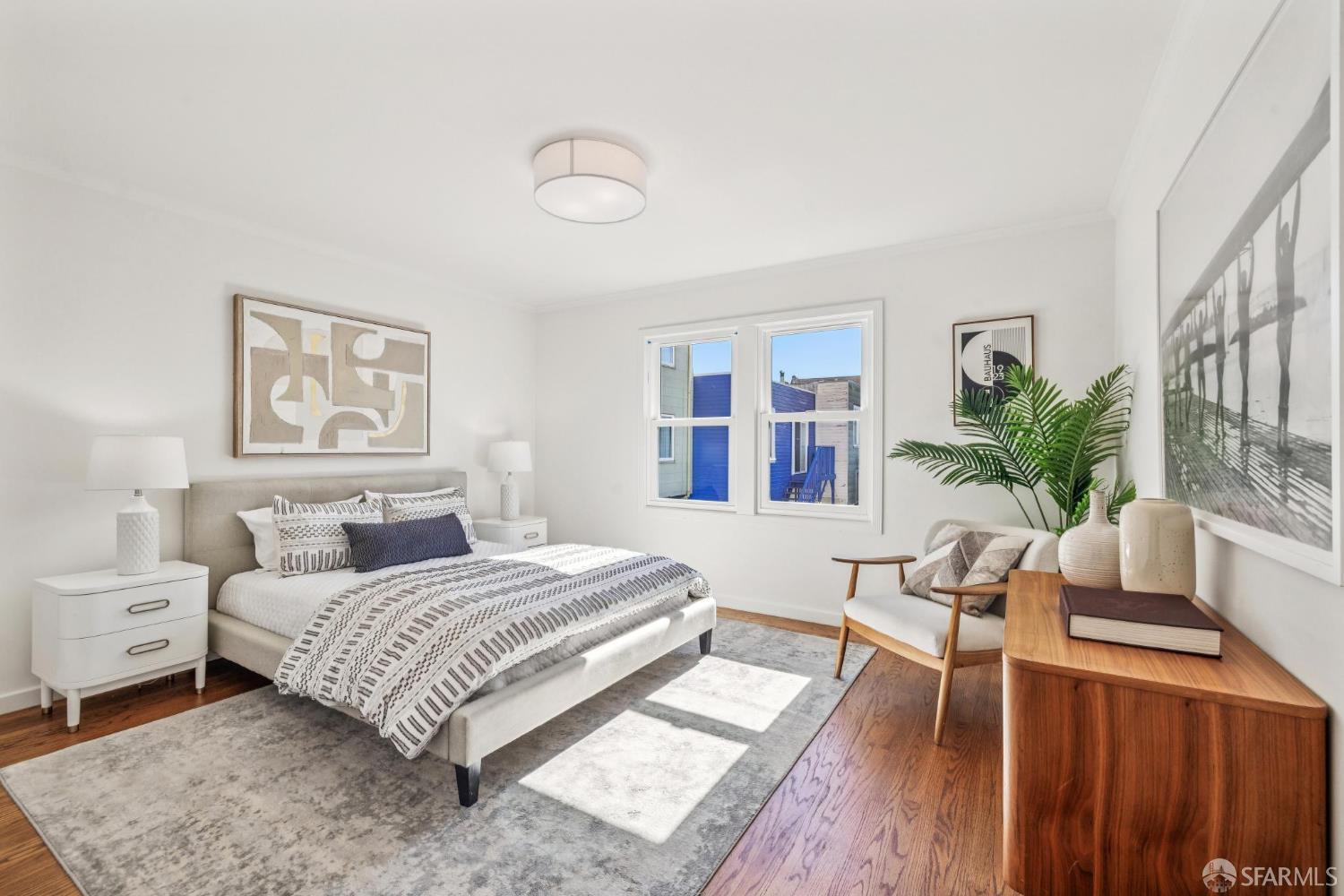2015-2017 Judah Street San Francisco, CA 94122 - Photo 15 of 58 a bedroom with a large bed a potted plant and a window