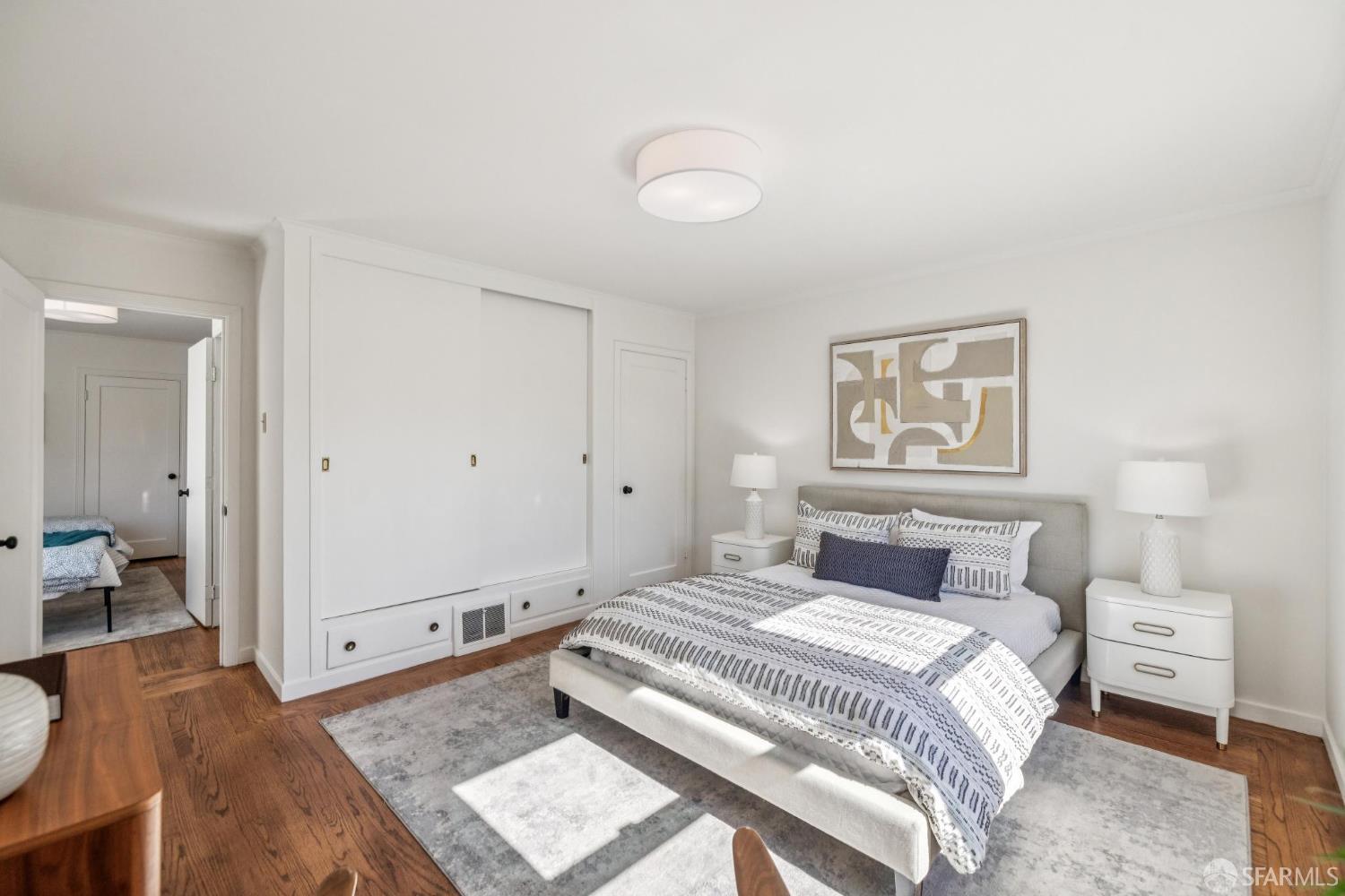 2015-2017 Judah Street San Francisco, CA 94122 - Photo 16 of 58 a bedroom with a bed and a painting on the wall