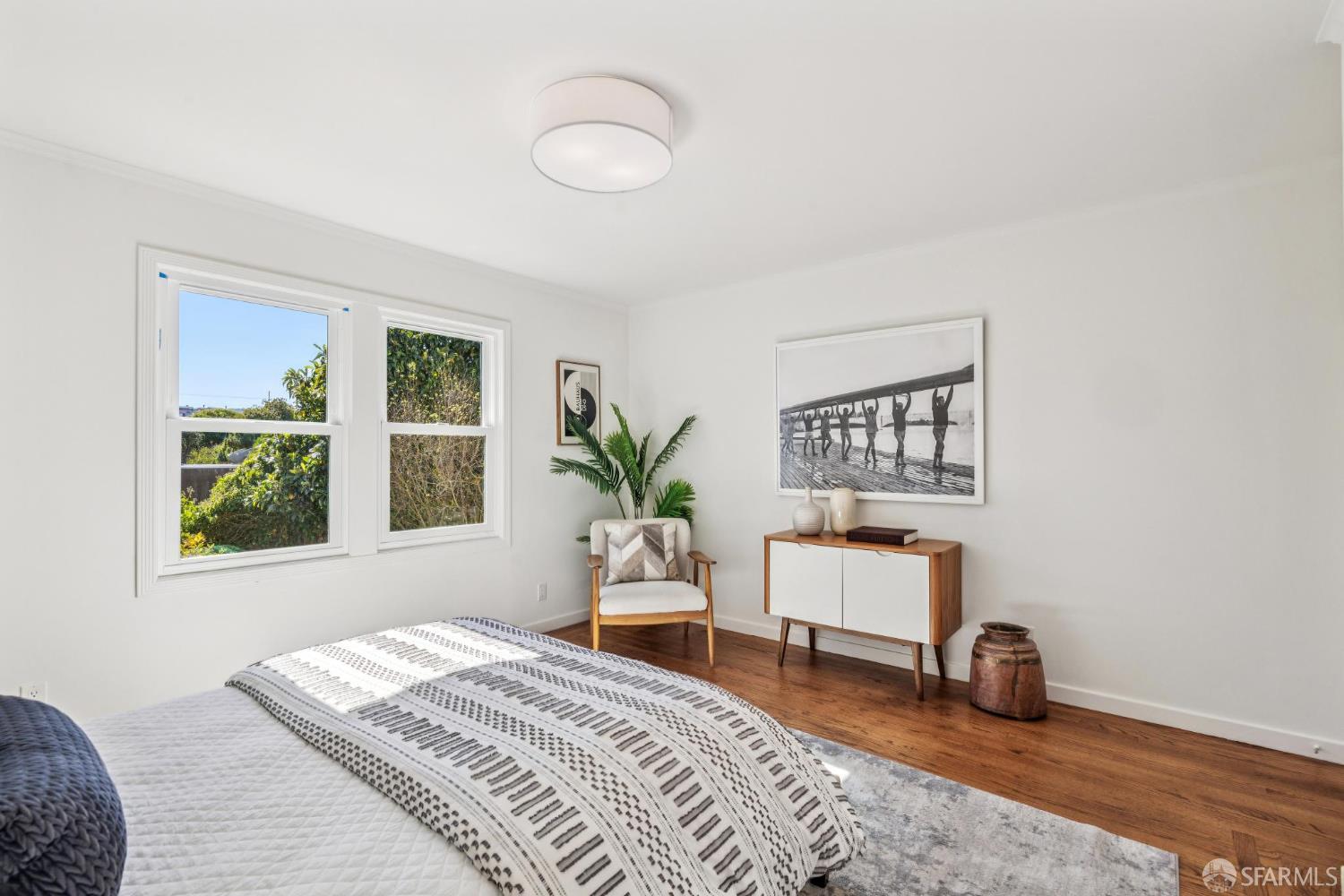 2015-2017 Judah Street San Francisco, CA 94122 - Photo 17 of 58 a bedroom with furniture and a window