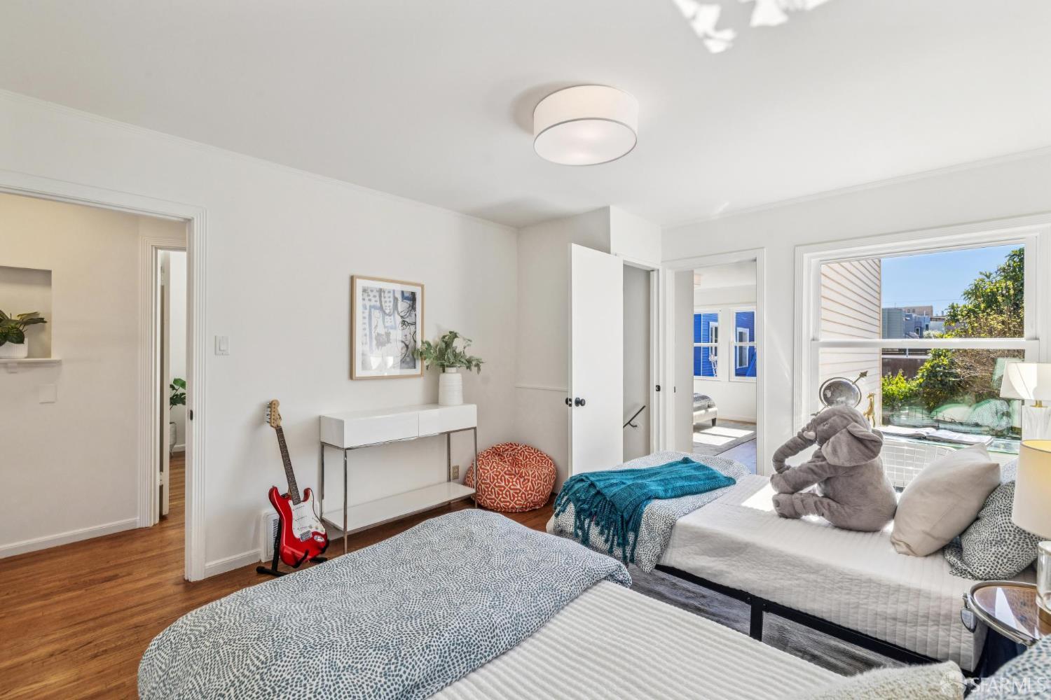 2015-2017 Judah Street San Francisco, CA 94122 - Photo 19 of 58 a living room with furniture and a large window