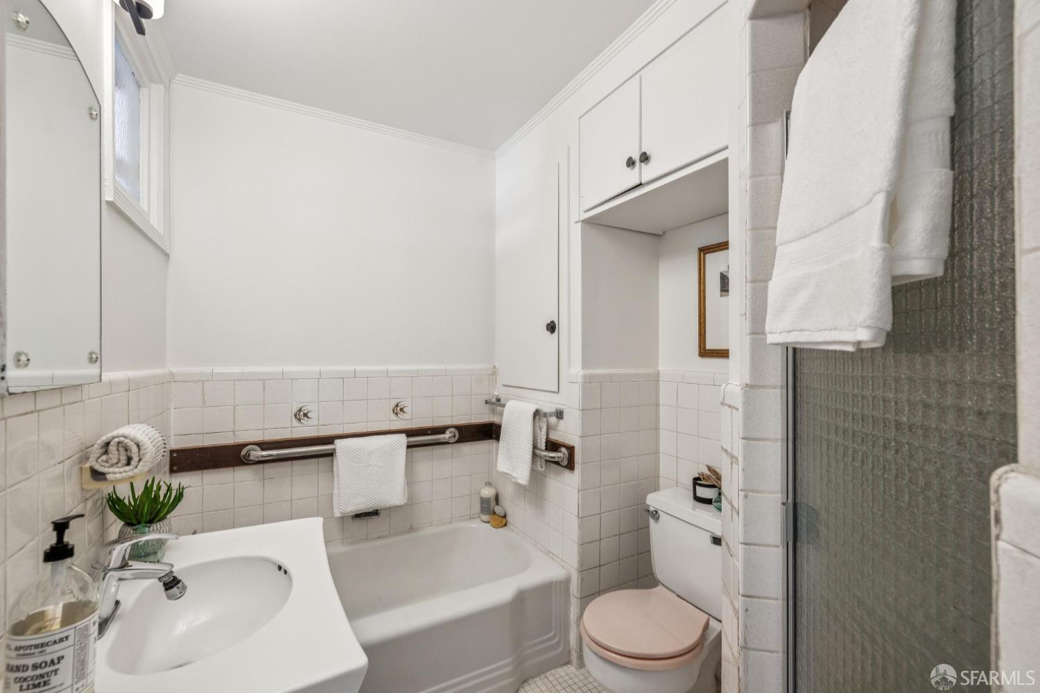 2015-2017 Judah Street San Francisco, CA 94122 - Photo 20 of 58 a bathroom with a sink toilet and shower