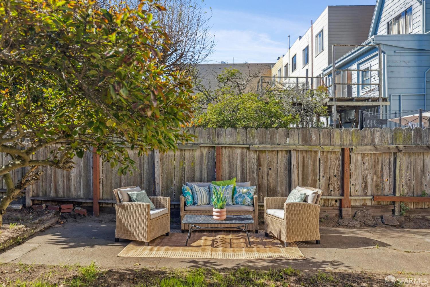 2015-2017 Judah Street San Francisco, CA 94122 - Photo 27 of 58 a view of a patio with couches chairs and wooden fence