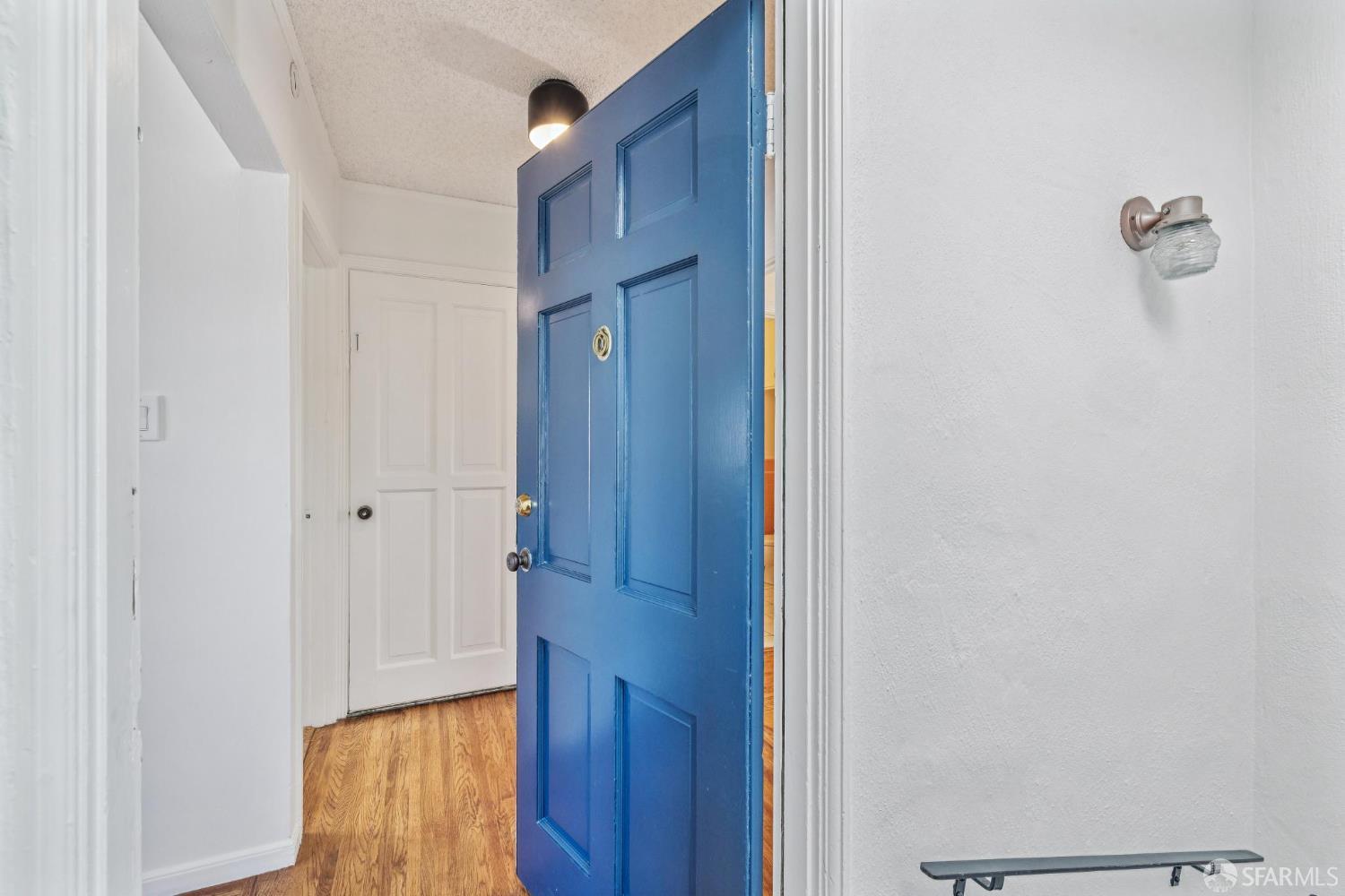 2015-2017 Judah Street San Francisco, CA 94122 - Photo 32 of 58 a view of a hallway with wooden floor